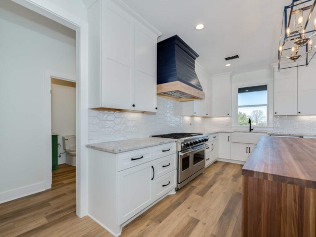 Kitchen of the Willow Project by LaFollette Custom Homes with beautiful wood island.