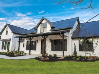 The Atnip Project by LaFollette Custom Homes with a white exterior and black accents.