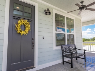 The Chisam Project by LaFollette Custom Homes with a modern porch.