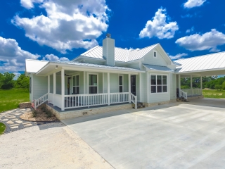 The Chisam Project by LaFollette Custom Homes with a white exterior.