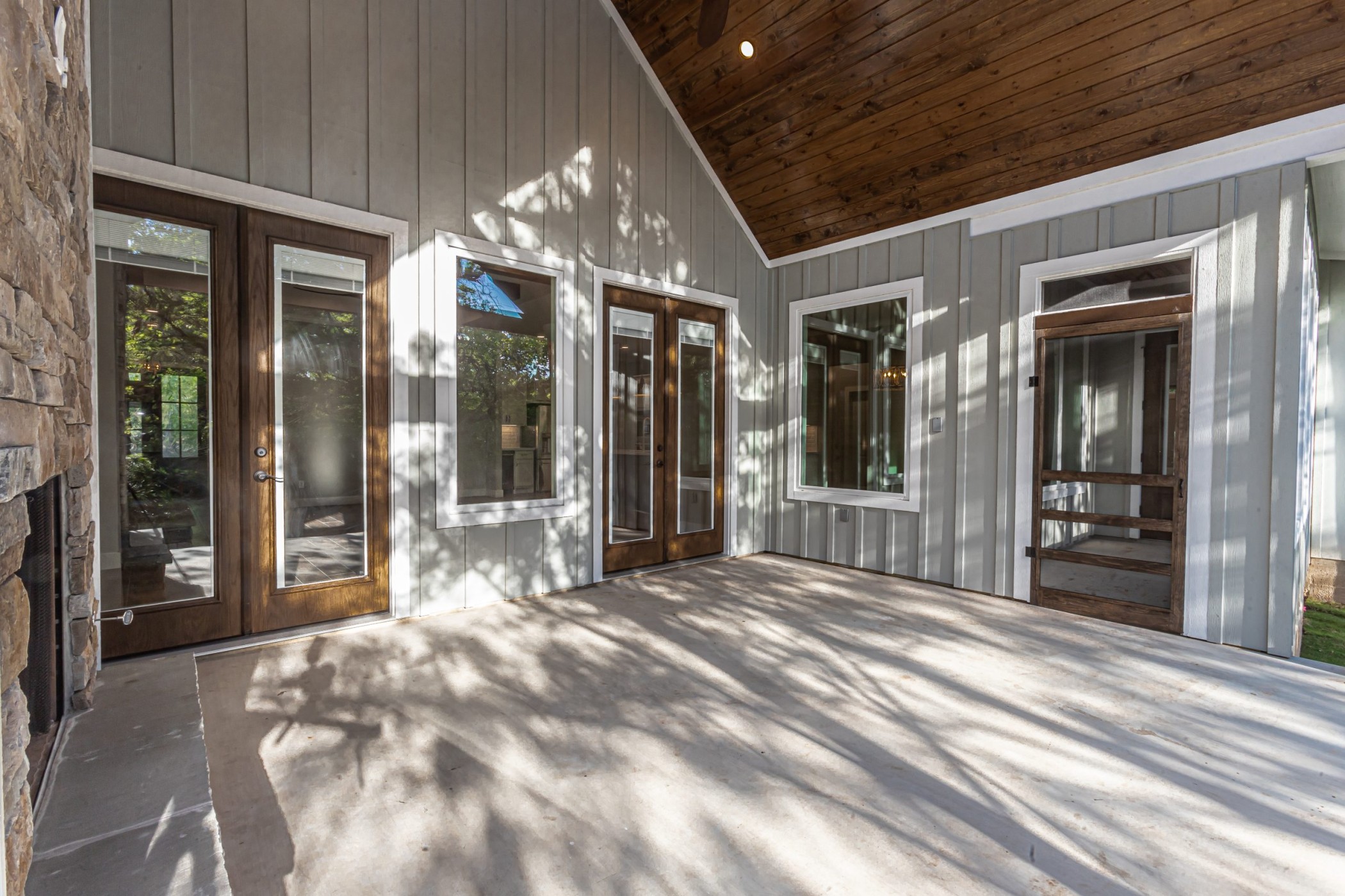 Stunning image of many French doors on a custom built home.