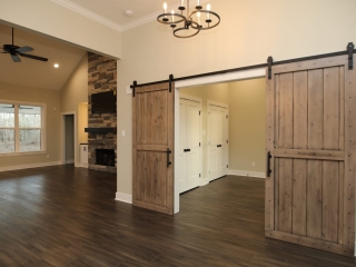 Entry of The Farmhouse Project Custom Home with neutral wood details.
