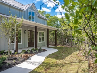 The Cedar Project by LaFollette Custom Homes with a large porch.