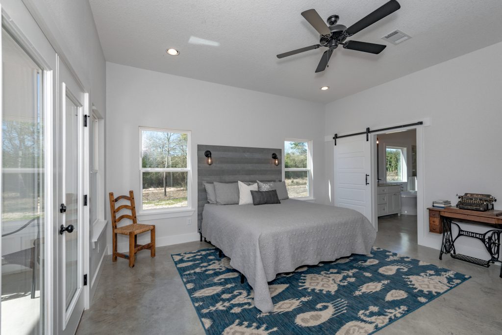 Custom built master bedroom with sliding barn doors.