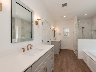 Master bath of the New Waverly Project by LaFollette Custom Homes with white countertops.