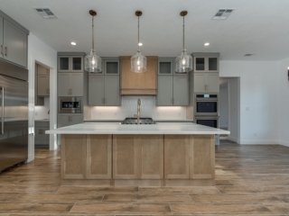 Wood detailing is featured in the kitchen of the Hollow Project by LaFollette Custom Homes