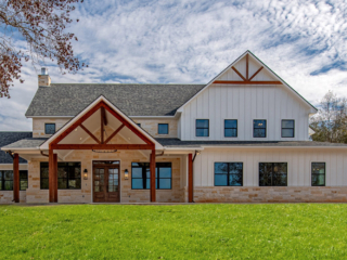 The Oak House Project by LaFollette Custom Homes with red wood accents.