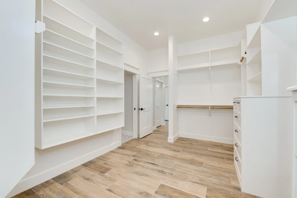 Custom Closet Design Ideas by LaFollette Custom Homes featuring built-in shelving and open storage