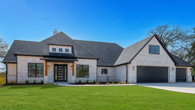 Custom Home Craftsmanship in 2026 by LaFollette Custom Homes featuring a large brick exterior home with modern design