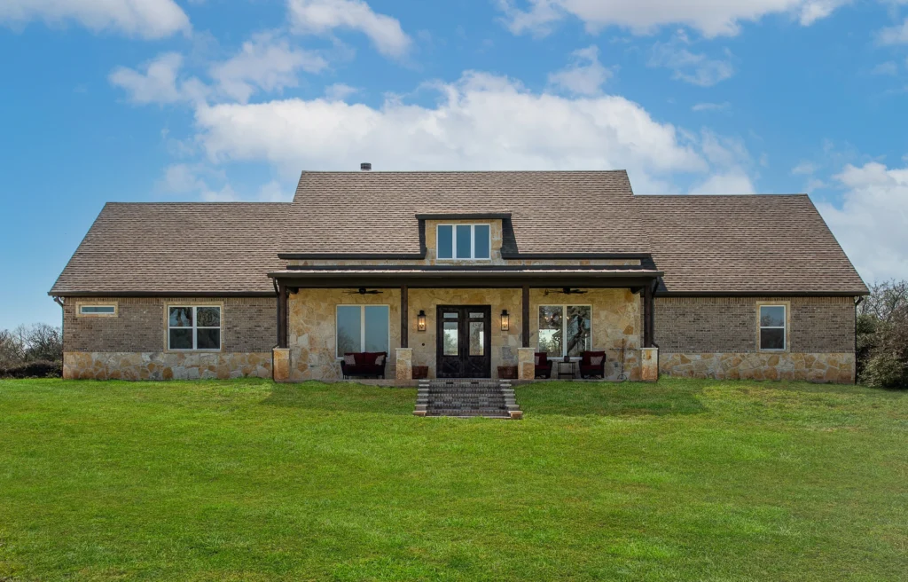 Custom home building mistakes guide featuring a finished LaFollette Custom Homes exterior