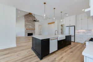 Open floor plan custom home with kitchen, living room, and natural light