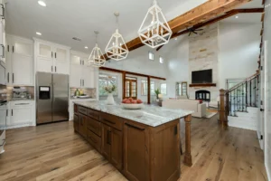 Most used rooms in a custom home featuring an open kitchen and living area